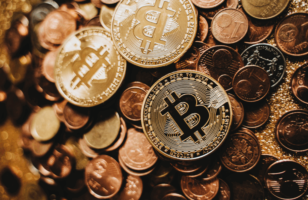 old Bitcoin tokens surrounded by traditional coins, symbolizing Texas’s new Bitcoin reserve legislation.